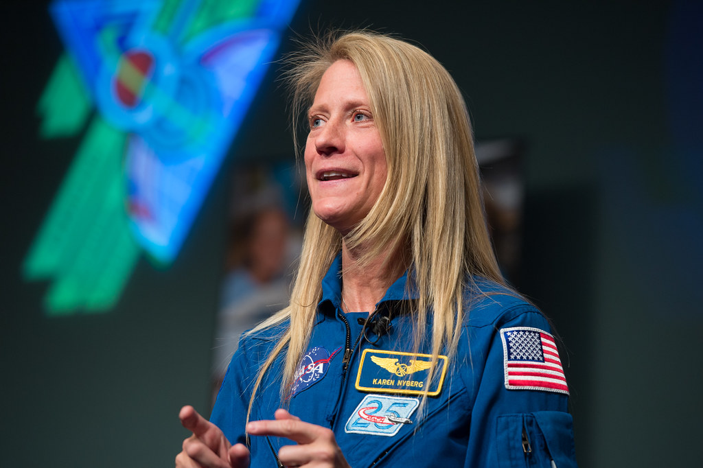 Karen Nyberg, an astronaut-artist, reveals quilt portraits honoring pioneering women who ventured into space.
